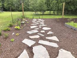 Stone paths offer a practical route for foot traffic from the sidewalk or driveway to your front door and along the side or back of the house. How To Lay A Flagstone Pathway Grace In My Space