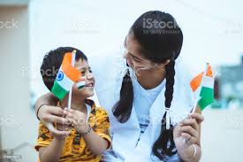 Happy Indian Teenager Girl With Little Boy Holding National Indian Flag  With Pride Stock Photo - Download Image Now - iStock