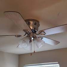 to balance a ceiling fan using a coin