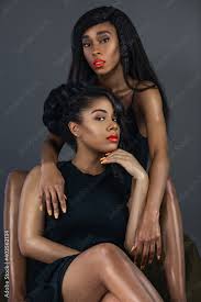 a portrait of 2 young melanin queens