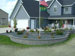 The front yard is your home's calling card. Retaining Wall Landscaping Around Flag Pole Oasis Landscapes West Fargo Fargo Moorhead
