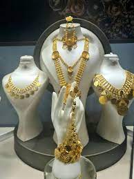 gold jewelry with a woman s head