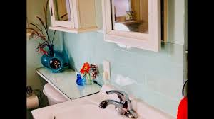 This will protect the most vulnerable areas of the wall behind your bathroom sink or sinks. Make A Stylish Bathroom Backsplash With Easy To Install Peel And Stick Tiles Youtube