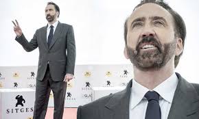 Nicolas Cage Looks Sharp In Grey Suit As He Promotes His