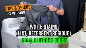 remove lint detergent stains tub odor