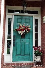 Here, the black entrance door of this historic home is enhanced with accents of olive green, cream and red. A Collection Of Turquoise Doors Sonya Hamilton Designs Turquoise Door Painted Front Doors Teal Front Doors