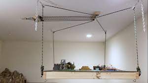 Is overhead garage storage safe? How To Make A Pulley Winch System That Raises A Warhammer Table To The Ceiling Youtube