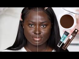 dark skin woman tries elf camo powder