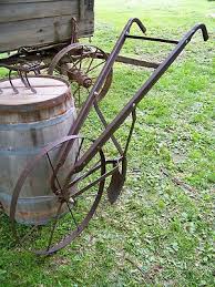 antique steel wheeled garden push plow