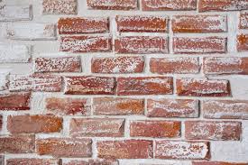 Red Brick Wall Painted With White Paint