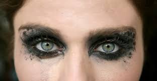 green eyes woman black makeup eye shadow