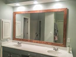 We framed vanity mirrors for less than $40 in wood. How To Diy Upgrade Your Bathroom Mirror With A Stained Wood Frame Building Our Rez