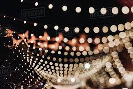 Defocused Image Of Illuminated String Lights During Night Stock Photo Dissolve