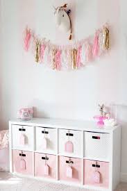 pink and white striped girls playroom
