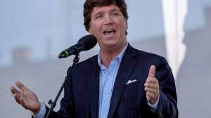 Show Tucker Carlson in a Patagonia Vest ...