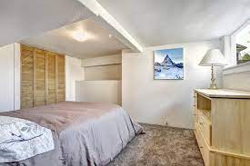 cozy bedroom with low ceiling stock