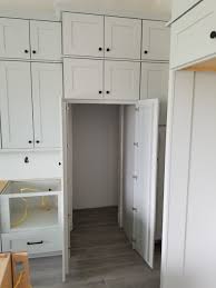 installing hidden walk in pantry cabinets