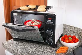 a toaster oven in the cabinet