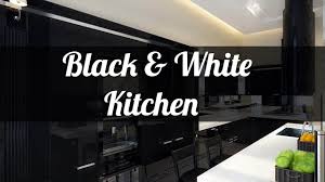 In a martha's vineyard home by architect mark hutker, the kitchen features black granite counters and rustic wood ceiling beams. 25 Black And White Kitchen Design Ideas Youtube