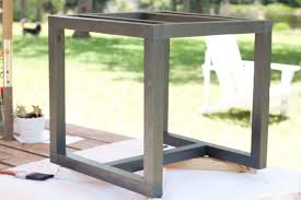 The patio table is a round table which stands on four legs that branch out from the center. Diy Outdoor Side Table Pottery Barn Knockoff