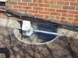 At this point, attach the dryer vent through the hold and place the material in the window, caulking it to keep it in place. Vented Window Well Covers With Custom Size Options