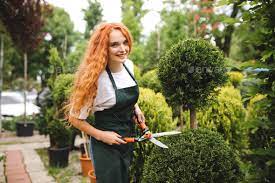 Pretty Smiling Lady Gardener With Redhead Curly Hair Standing In Apron  gambar png