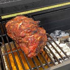 pork shoulder on charcoal grill bear