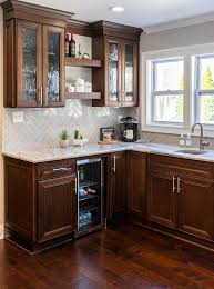 brown cabinets and black appliances
