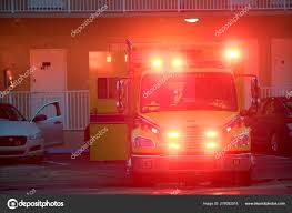 Ambulance Responding To An Accident Scene With Flashing