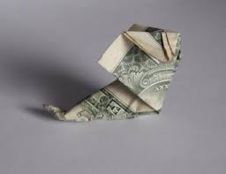 This money origami craft is great for hanging from a string during christmas. Christmas Origami Using Money Lovetoknow