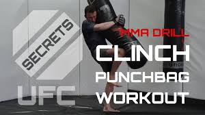 mma workout clinch work on heavy bag