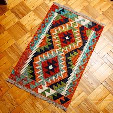 hand knotted wool area rug with rhombus