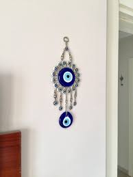 Create a comfy, unique abode with custom accessories. Silver Evil Eye Wall Hanging Metal Evil Eye Home Decor Blue Glass Bead Turkish Eye Homedecor Silver Housewarming Handmade Evil Eye Wall Hanging Eye Decor