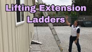 lifting an extension ladder and safe