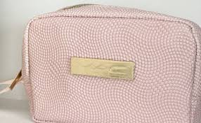 pink vegan leather embossed makeup bag