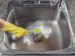 cleaning kitchen sink with baking soda