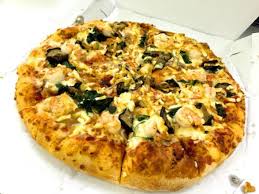 we try tom yum pizza the new domino s