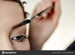 makeup artist styling eyebrow woman