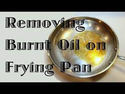 removing burnt oil from a frying pan