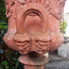 set richly decorated stone garden vases