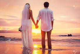 Bride And Groom, Enjoying Amazing Sunset On A Beautiful Tropical Beach,  Romantic Married Couple Stock Photo, Picture And Royalty Free Image. Image  24490427.