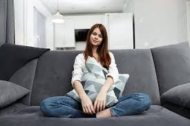 Woman Lounging With Pillow At Home Well