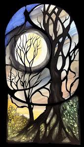 A Stained Glass Window With A Moon And