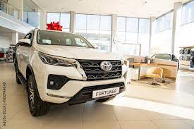 car toyota fortuner with red gift bow