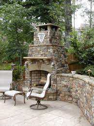 Stone Outdoor Fireplace With Retaining