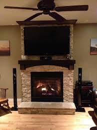 stone fireplace with tv stone on