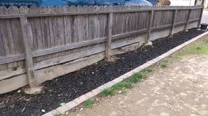 retaining wall and fence on property line
