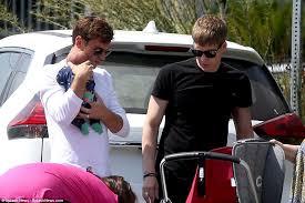 The father of tom daley the teenage british diving champion has died aged 40 following a battle with brain cancer. Tom Daley 24 And His Husband Dustin Lance Black 44 Step Out With Their Newborn Son Robert Ray For The First Time Photos