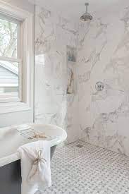 Tiny hexagonal mosaics on the bath and walls, medium hex tiles on the basin surround and large oblong tiles on the floor. 25 Ways To Mix And Match Tiles In Bathrooms Digsdigs