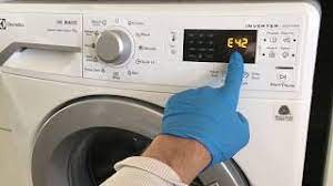 • unplug the machine for three minutes to unlock the door. How To Unlock Electrolux Washer